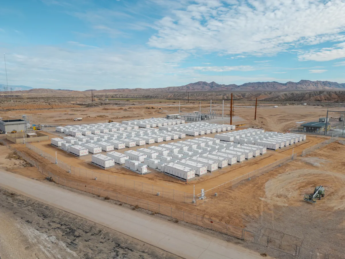 Rows of battery energy storage containers at a utility site