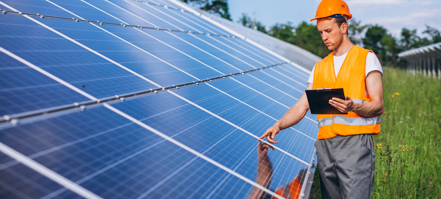 Engineer inspecting installed solar panels